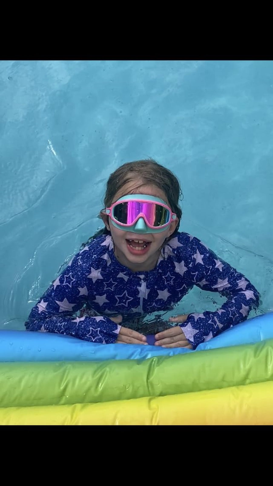 Child swimming in Vvinca nose-cover goggles