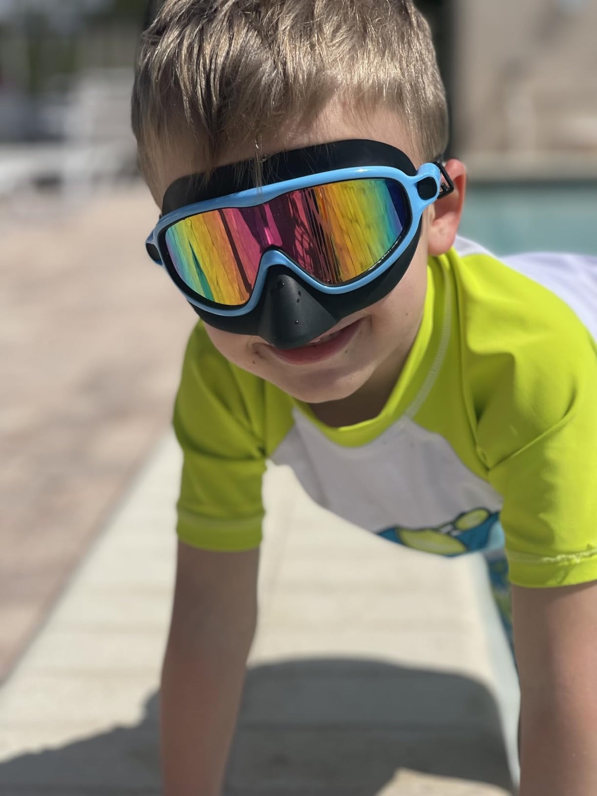 Child wearing blue Vvinca nose-cover goggles